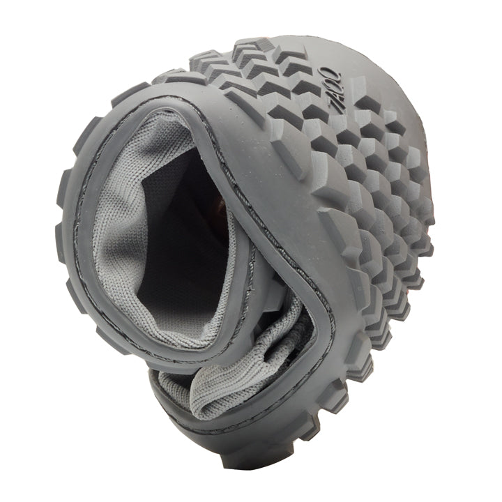 Up close, a rolled-up knee pad is seen in gray with a textured honeycomb pattern on the outside and a soft lining similar to the comfort of the SOQQ Cat Gray. On the surface is the brand name ZAQQ clearly visible.