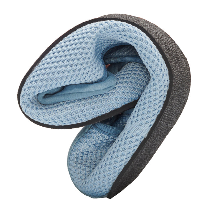 A pair of TWIST jeans from ZAQQ featuring a blue mesh design folded in half with the soles facing out. The super flexible sole and breathable mesh show off their compressibility for easy packing or storage against a white background.