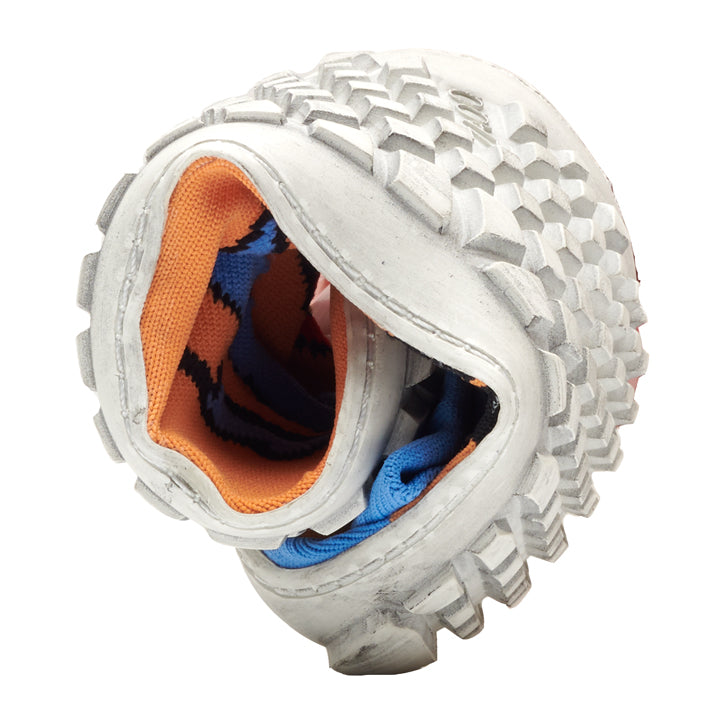 Close-up of the flexible sole of the SOQQ Cat Blue by ZAQQ, which is twisted in a spiral and gives a unique barefoot feeling. The outsole features a white grid pattern while the interior features a bright orange and blue fabric lining.