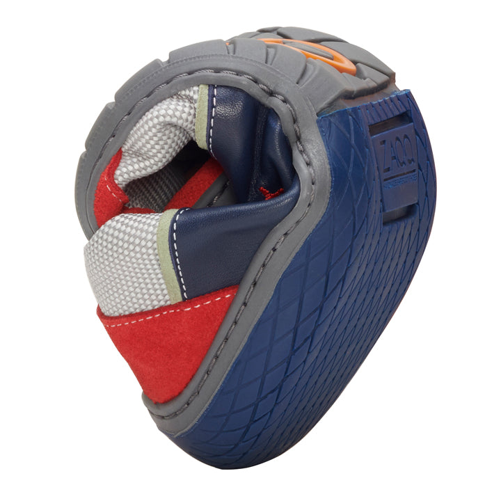 A close-up of a colorful baseball glove with detailed stitching and padding. The ZAQQ QOLETTE Blue glove features a mix of blue, red, gray and white hues with a textured finish and eye-catching brand markings.