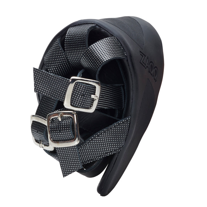 A close-up of the QORA Black Silver hoof boot from ZAQQ features two adjustable straps with silver buckles. This shoe, ideal for an extravagant fashion style, has a textured surface and clearly shows the brand name ZAQQ on the page. Specially developed for use with horses.