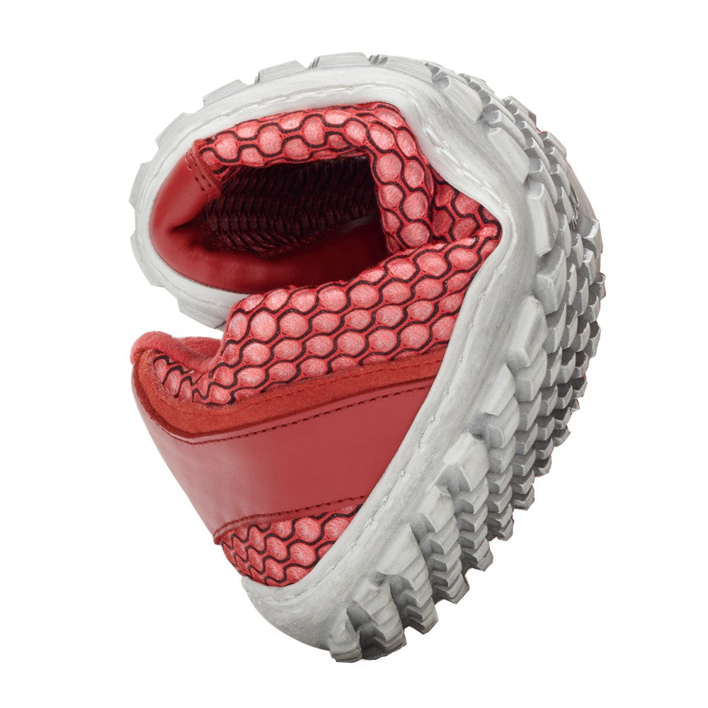 We present the TOQIO Red from ZAQQ, a state-of-the-art sneaker made from innovative red and white mesh fabric. It is presented with a folded flexible sole to demonstrate its adaptability. The textured gray outsole with distinctive treads provides a striking contrast to the striking red lining and details.